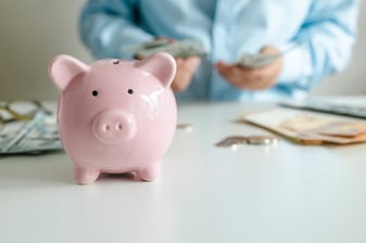 business-woman-counts-dollar-banknotes-money
