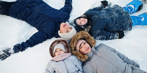 mother-playing-with-children-in-winter-nature-out